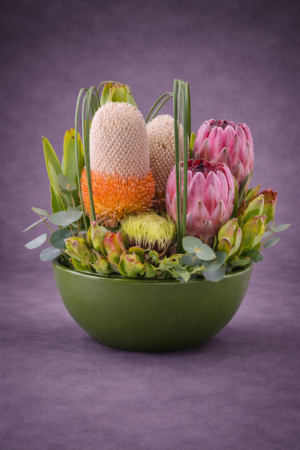 Exotic Floral Arrangement in Green Bowl –