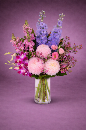 Vibrant Floral Arrangement in Clear Vase –